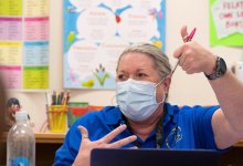 Teacher urges students to use a thumbs up 