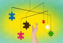 Illustration of hand reaching for puzzle pieces